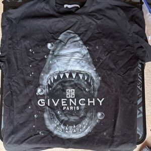 Black shirt with shark.